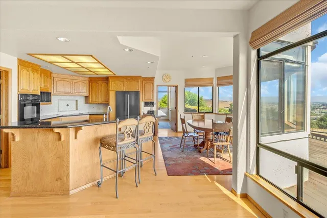 a bathroom with a granite countertop sink and a large mirror