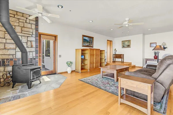 a living room with furniture and a floor to ceiling window