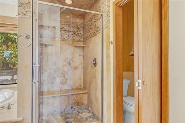 a view of a bathroom from a hallway