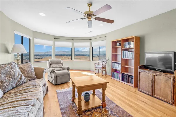 a view of a chairs and table in the patio