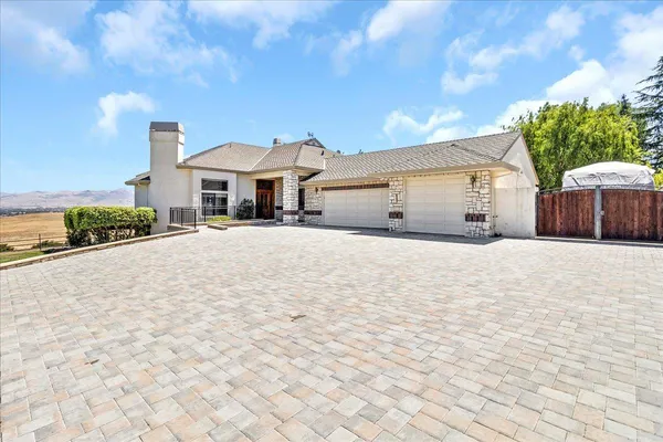 a living room with furniture wooden floor and a rug