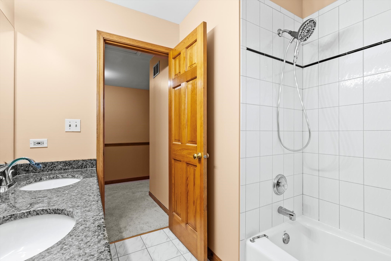 1107 Conan Doyle Road Naperville, IL 60564 - Photo 15 of 34 a bathroom with a granite countertop sink a mirror and shower