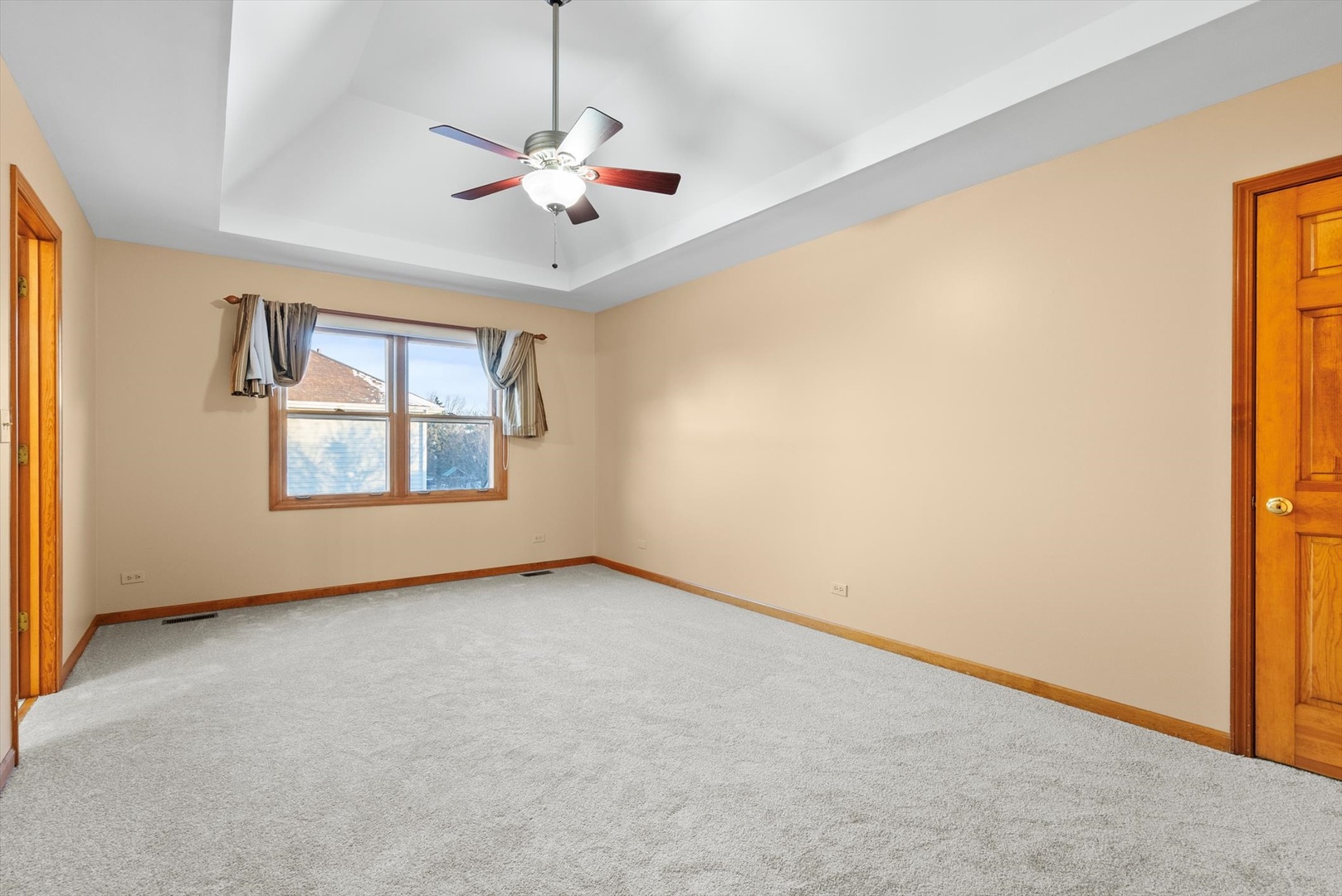 1107 Conan Doyle Road Naperville, IL 60564 - Photo 20 of 34 an empty room with windows and ceiling fan