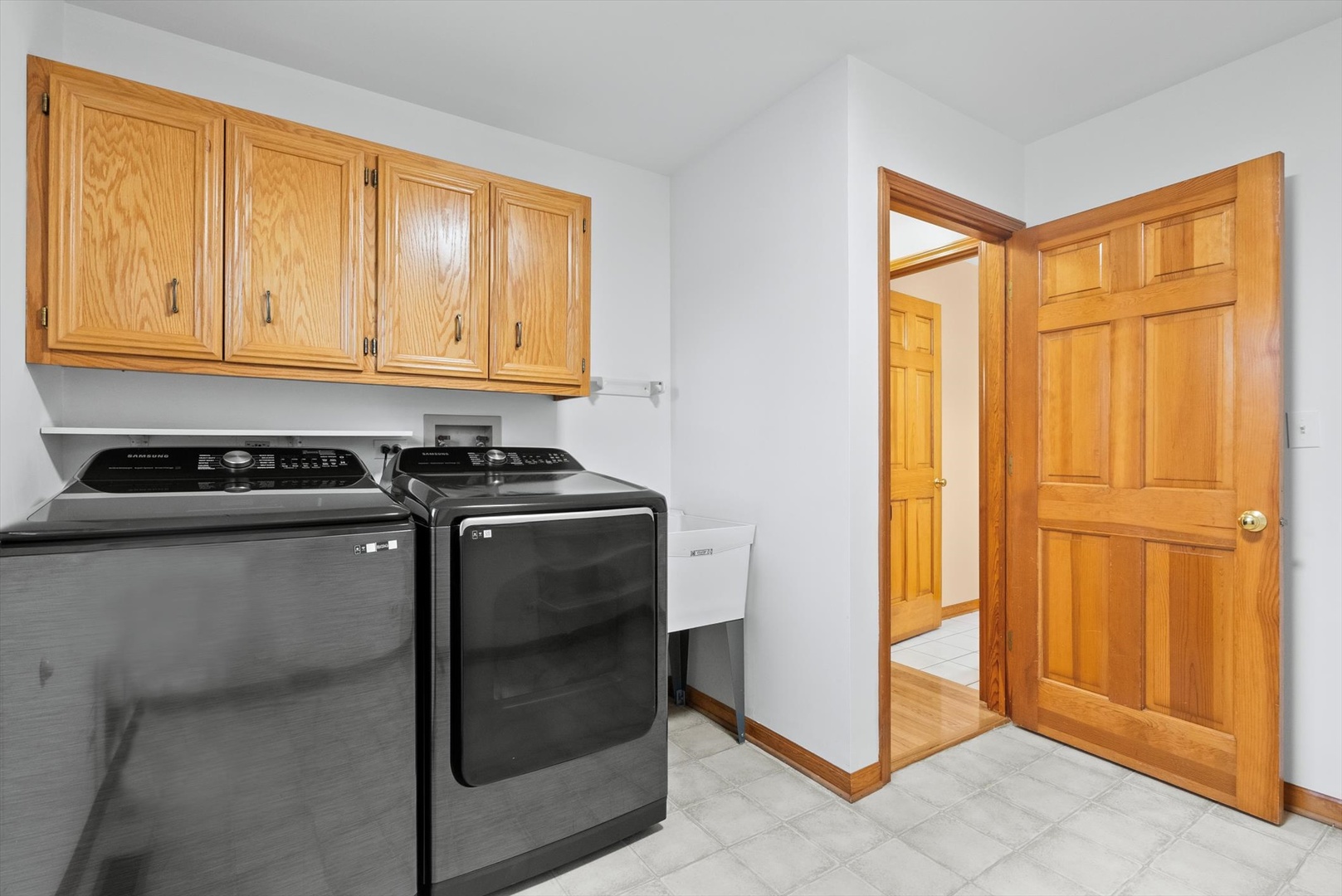 1107 Conan Doyle Road Naperville, IL 60564 - Photo 25 of 34 a kitchen with stainless steel appliances granite countertop cabinets and a refrigerator