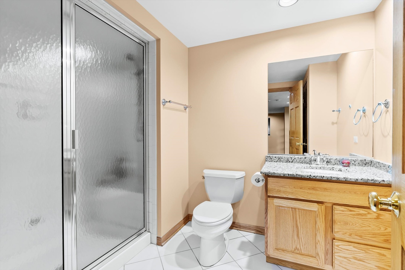 1107 Conan Doyle Road Naperville, IL 60564 - Photo 28 of 34 a bathroom with a granite countertop toilet sink and shower