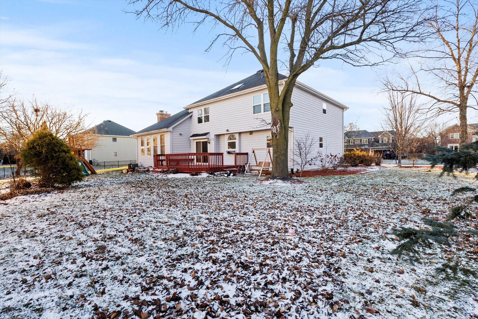 1107 Conan Doyle Road Naperville, IL 60564 - Photo 31 of 34 a view of a house with a yard covered with snow