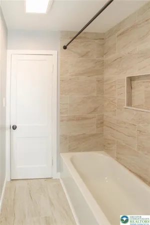 a bathroom with a bathtub