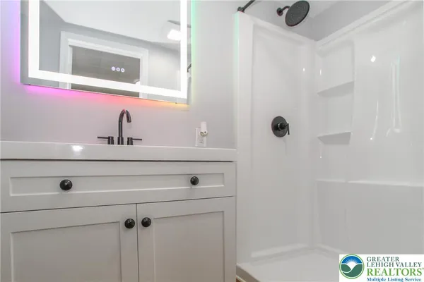 a bathroom with a sink and a mirror