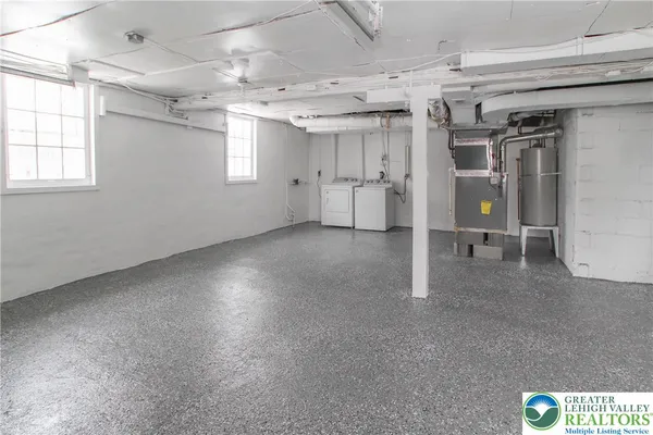 a view of a hallway with a kitchen
