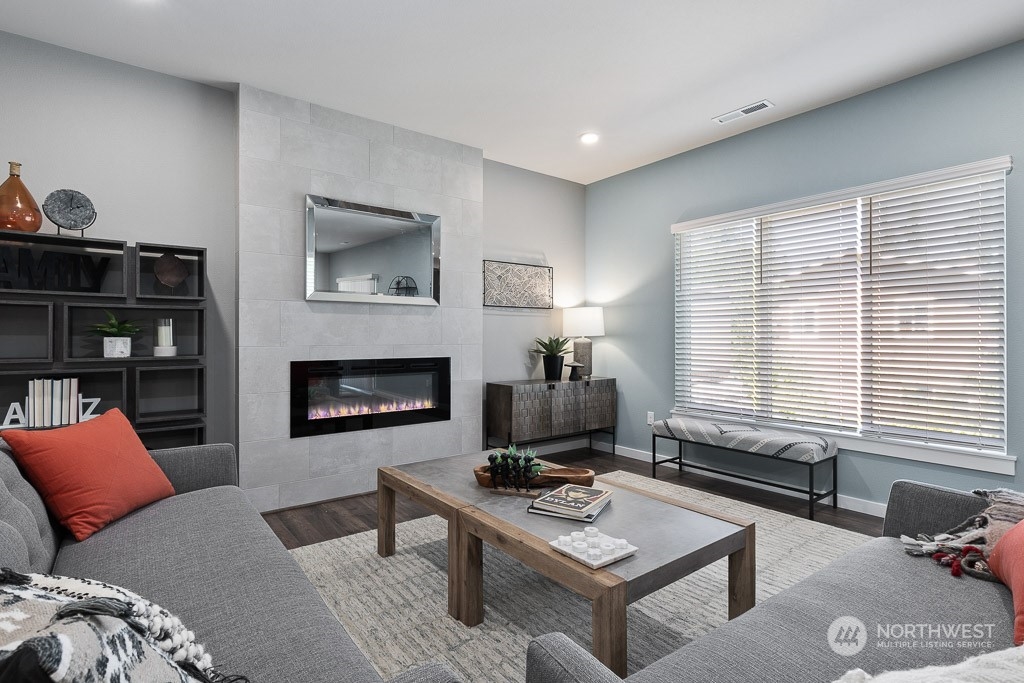 126 177th Street Southeast Bothell, WA 98012 - Photo 12 of 30 a living room with furniture a rug and a fireplace