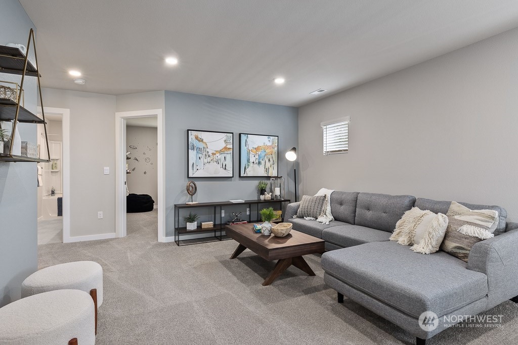 126 177th Street Southeast Bothell, WA 98012 - Photo 16 of 30 a living room with furniture and a large window