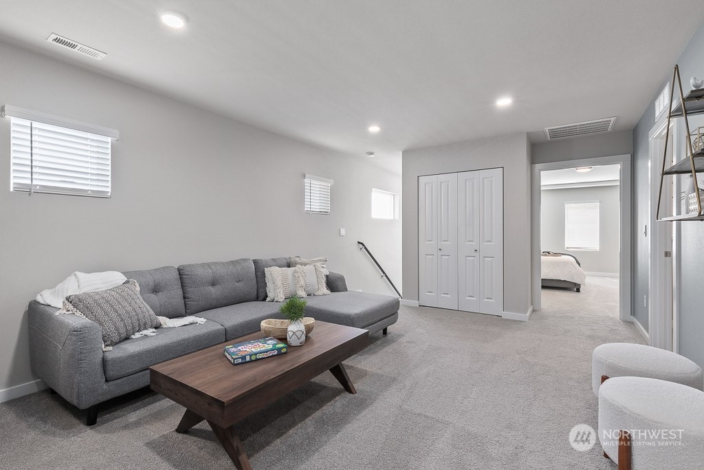 126 177th Street Southeast Bothell, WA 98012 - Photo 17 of 30 a living room with furniture and a table