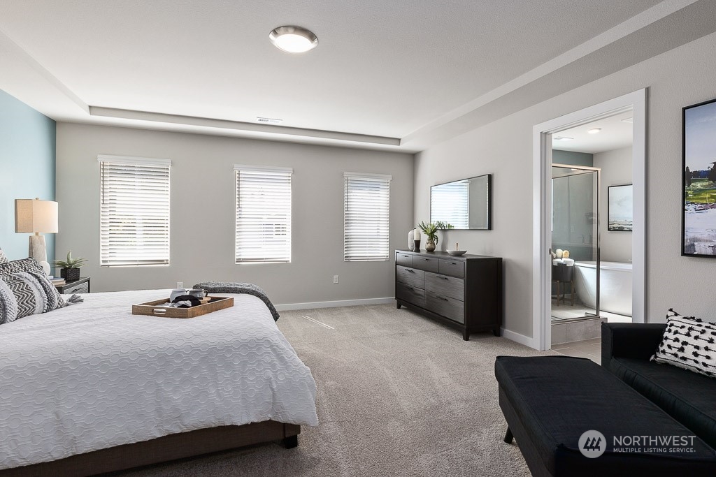 126 177th Street Southeast Bothell, WA 98012 - Photo 18 of 30 a bedroom with a bed and couch