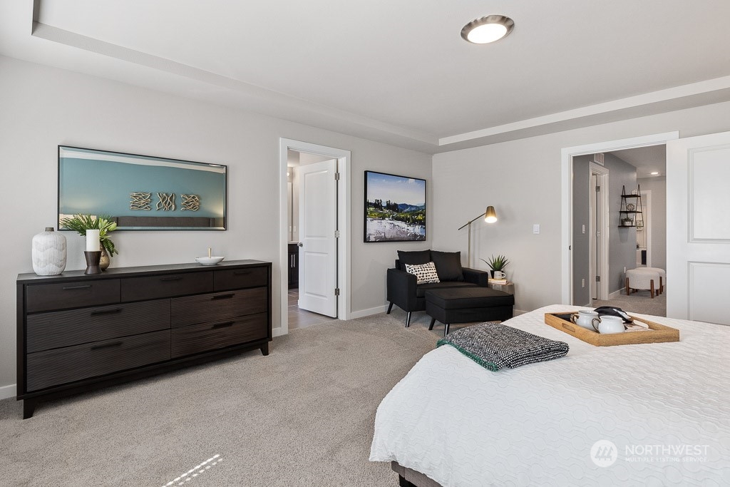 126 177th Street Southeast Bothell, WA 98012 - Photo 20 of 30 a bedroom with a bed and wooden floor