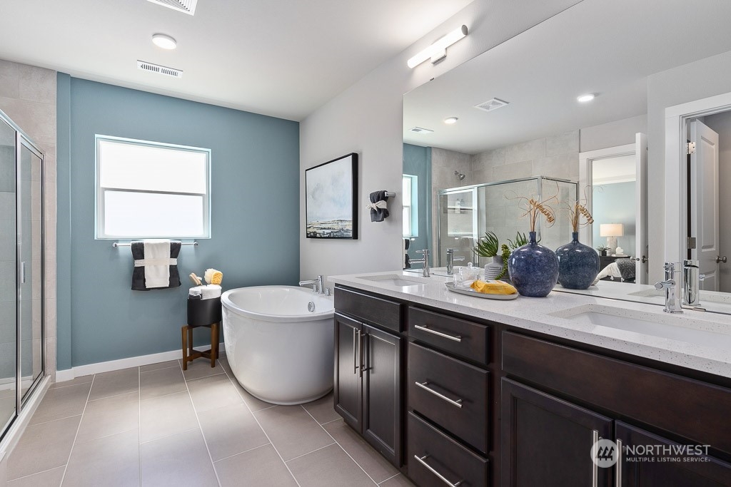 126 177th Street Southeast Bothell, WA 98012 - Photo 23 of 30 a bathroom with a sink a mirror and a window