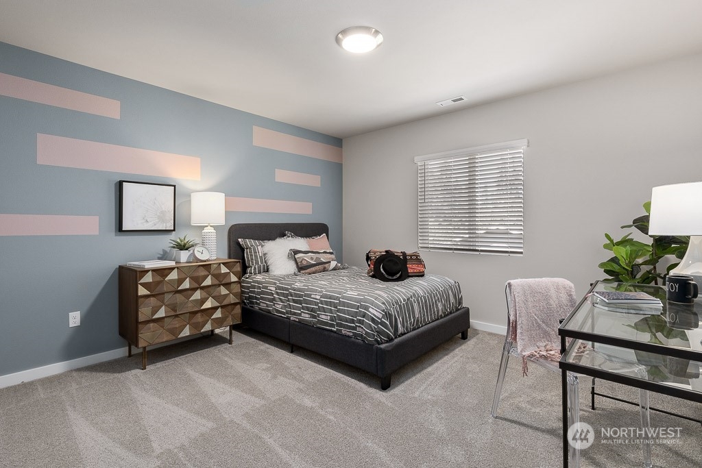 126 177th Street Southeast Bothell, WA 98012 - Photo 25 of 30 a bedroom with a bed and a couch