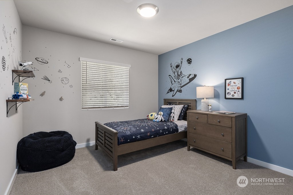 126 177th Street Southeast Bothell, WA 98012 - Photo 26 of 30 a bedroom with a bed and a window