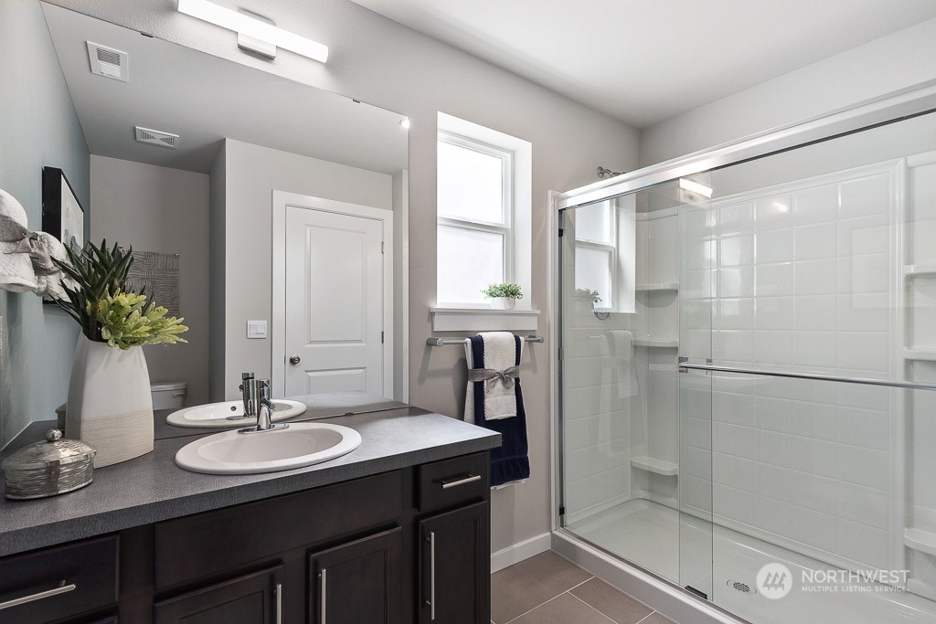 126 177th Street Southeast Bothell, WA 98012 - Photo 4 of 30 a bathroom with a sink and a mirror
