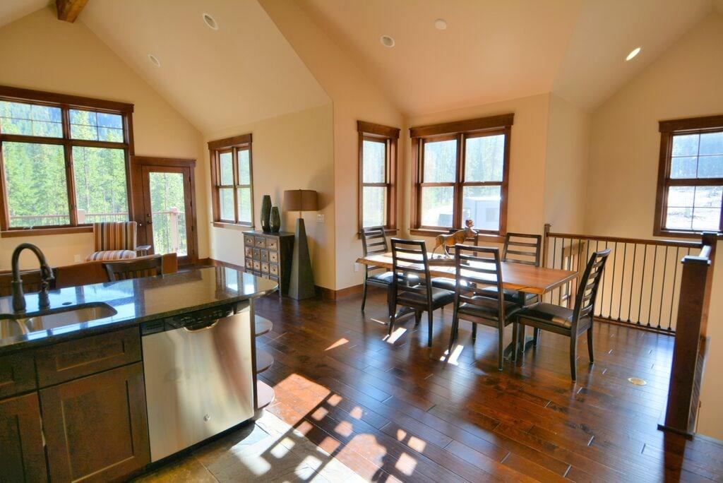721 Independence Road, Unit 13A Keystone, CO 80435 - Photo 16 of 25 a view of a dining room with furniture window and wooden floor