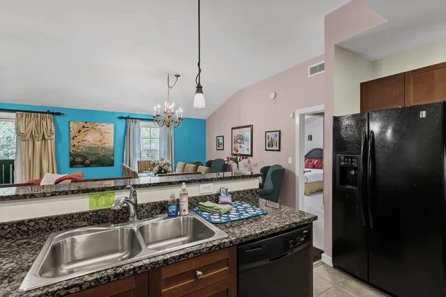 a kitchen with a refrigerator stove and microwave