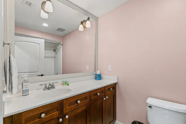a bathroom with a shower and a glass door