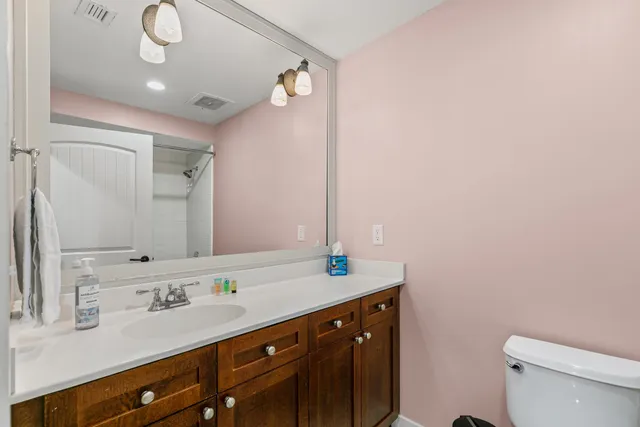 a bathroom with a shower and a glass door