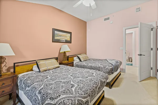 a bedroom with a bed and a television