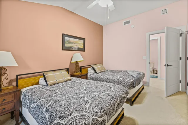 a bedroom with a bed and a television