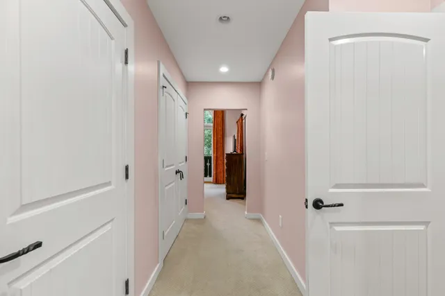 a bedroom with a bed and a lamp next to a window