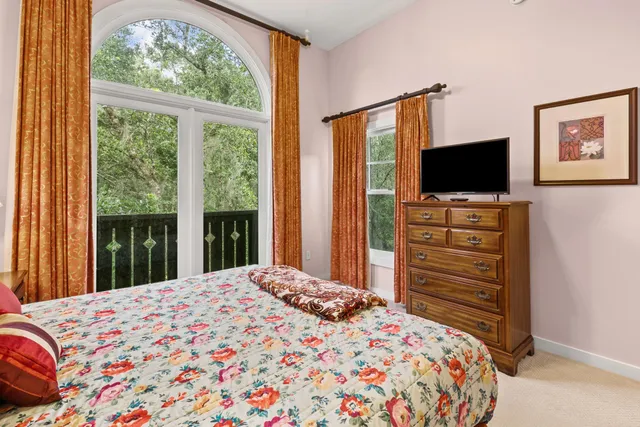a white bath tub sitting next to a white toilet