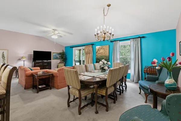 a view of a livingroom with furniture window and wooden floor