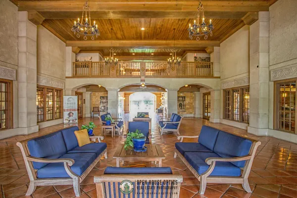 a bathroom with a tub shower and a sink
