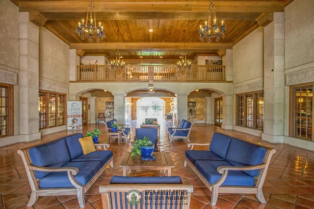 a bathroom with a tub shower and a sink