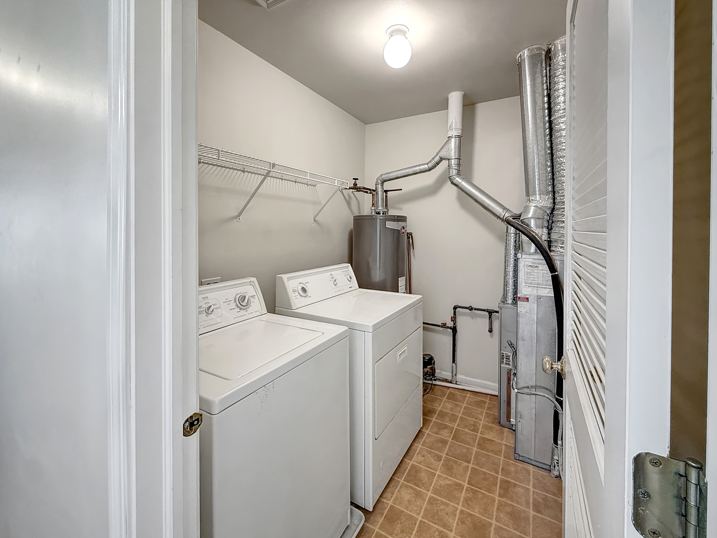 3078 Falling Waters Lane, Unit 3078 Lindenhurst, IL 60046 - Photo 11 of 19 a utility room with dryer and washer