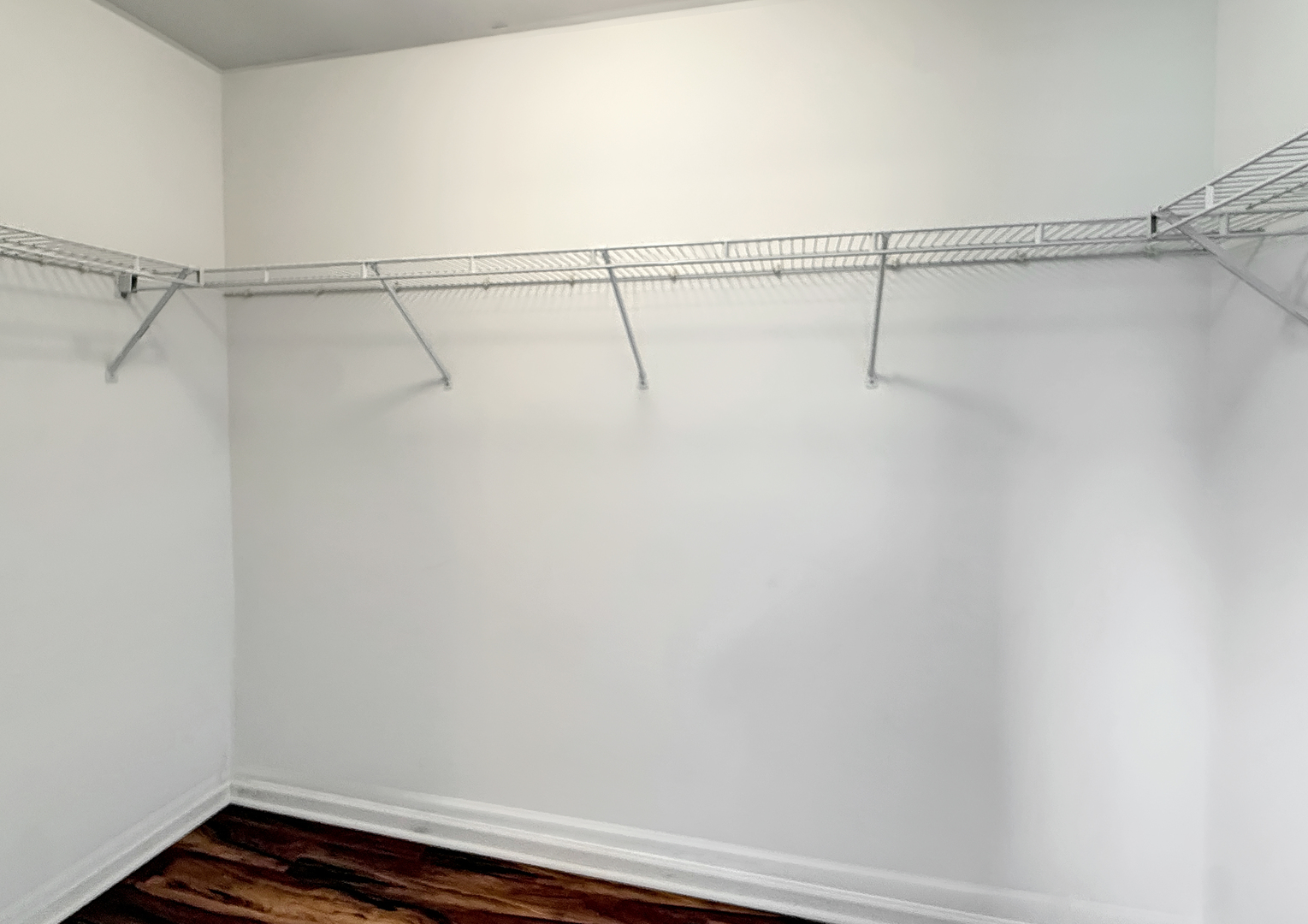 3078 Falling Waters Lane, Unit 3078 Lindenhurst, IL 60046 - Photo 13 of 19 a view of a room with racks on the wall