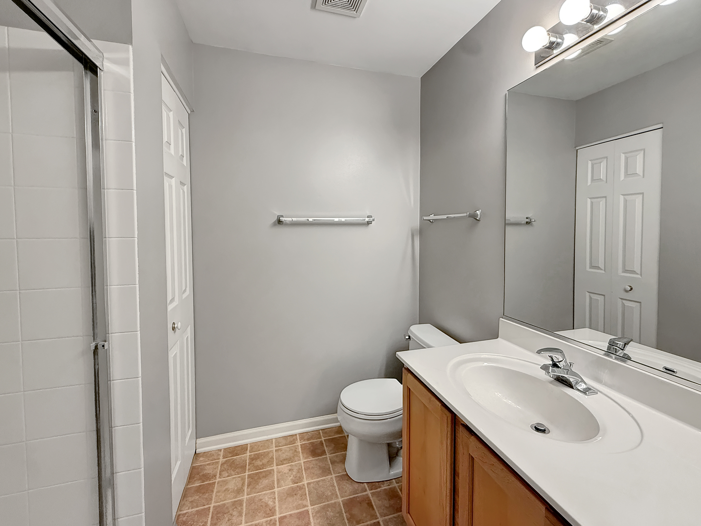 3078 Falling Waters Lane, Unit 3078 Lindenhurst, IL 60046 - Photo 14 of 19 a bathroom with a sink toilet and shower