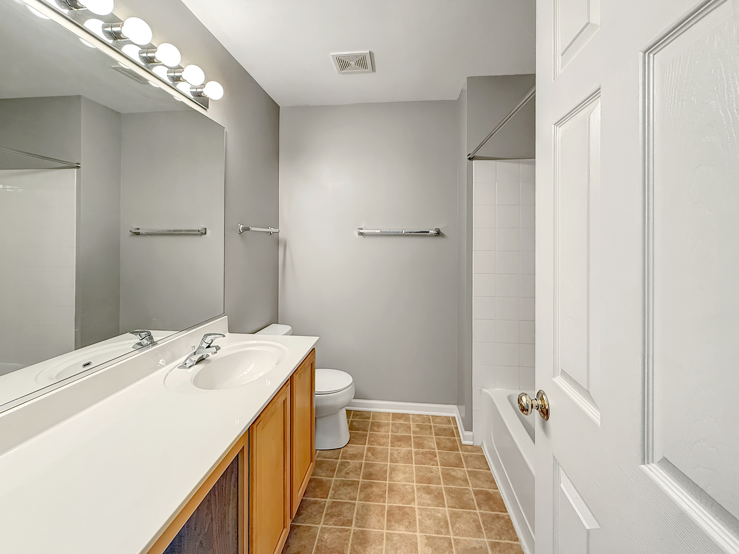 3078 Falling Waters Lane, Unit 3078 Lindenhurst, IL 60046 - Photo 17 of 19 a bathroom with a double vanity sink and a mirror