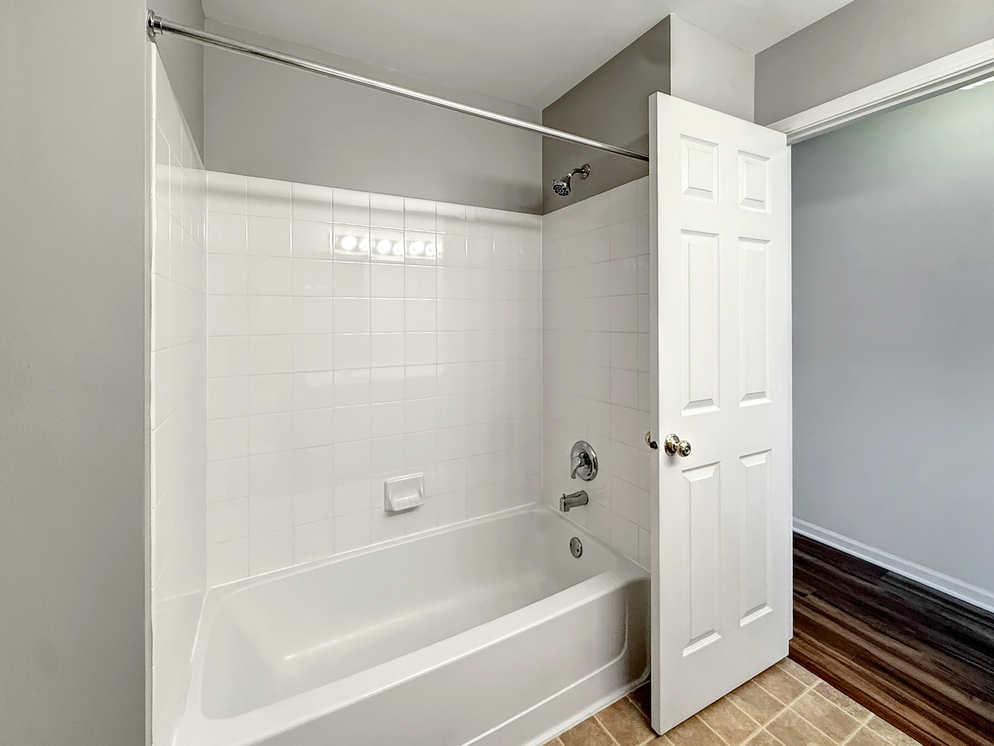 3078 Falling Waters Lane, Unit 3078 Lindenhurst, IL 60046 - Photo 18 of 19 a bathroom with a bathtub and a shower
