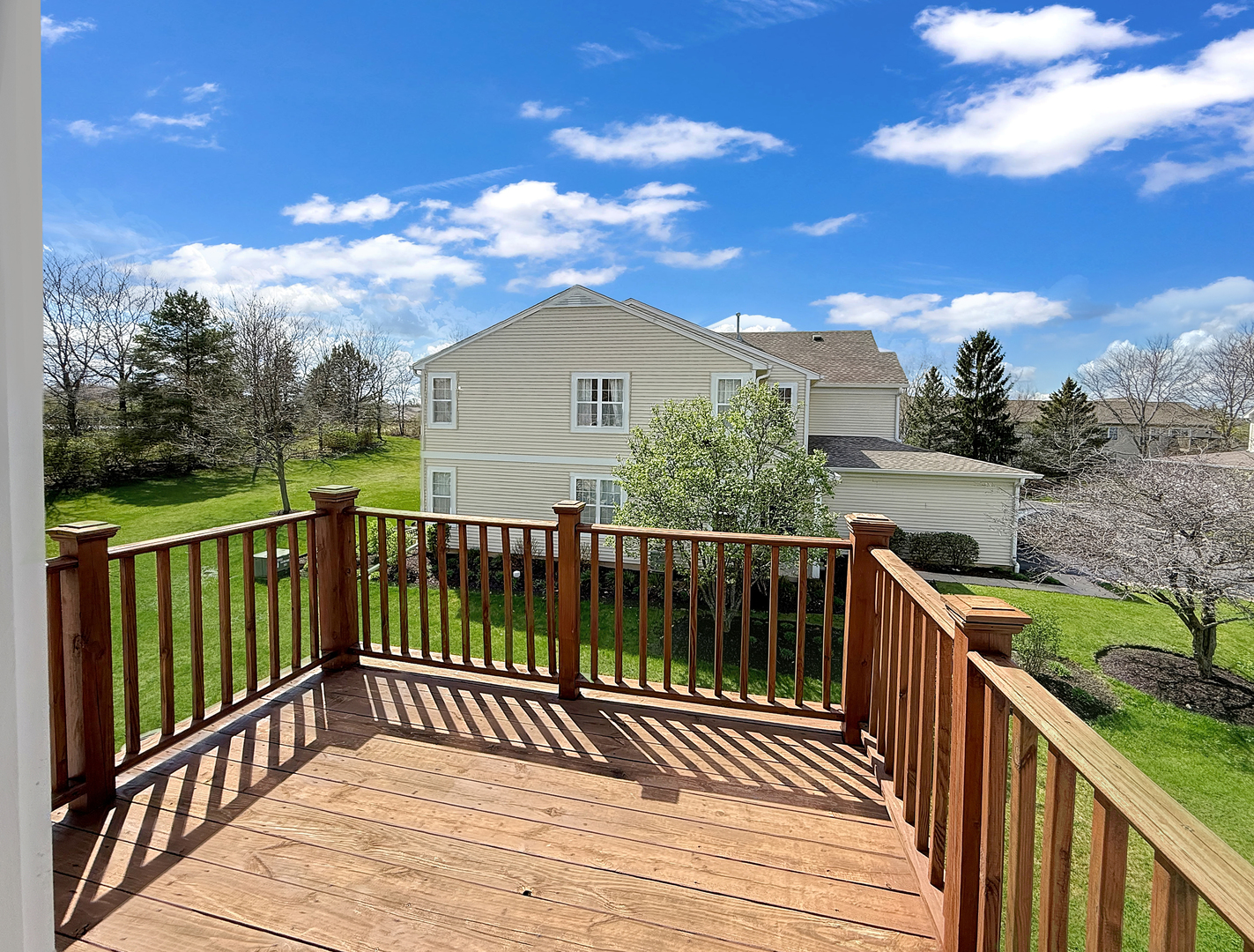 3078 Falling Waters Lane, Unit 3078 Lindenhurst, IL 60046 - Photo 19 of 19 a view of a wooden deck and city view