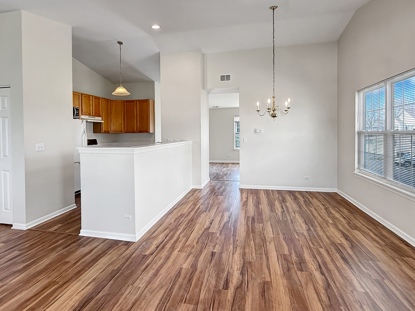 3078 Falling Waters Lane, Unit 3078 Lindenhurst, IL 60046 - Photo 6 of 19 a view of a kitchen with wooden floor and a sink