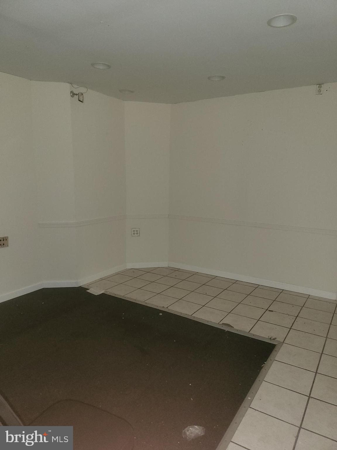 5700 Delancey Street Philadelphia, PA 19143 - Photo 4 of 12 an empty room with a yard