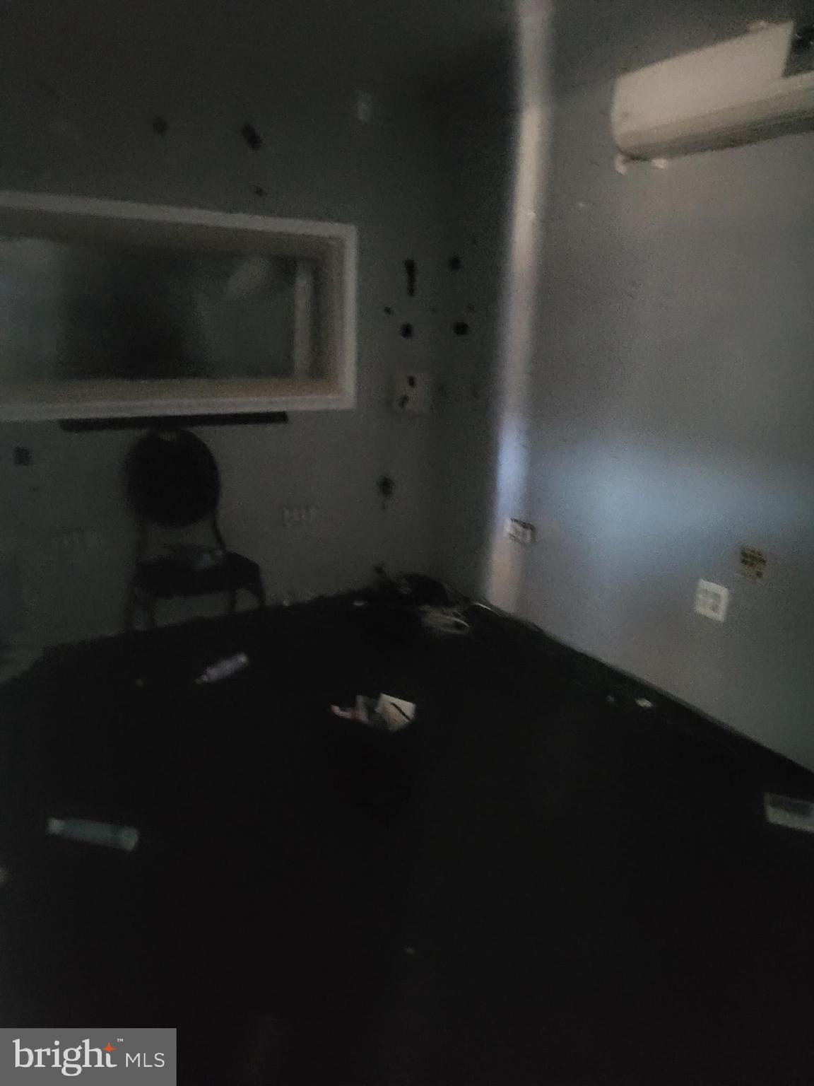 5700 Delancey Street Philadelphia, PA 19143 - Photo 7 of 12 a living room with a chair and a fireplace