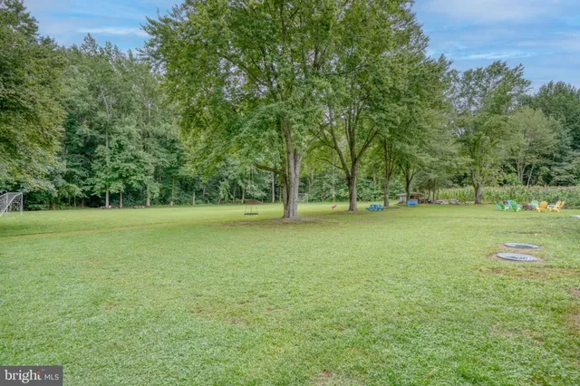 a view of outdoor space with deck and yard