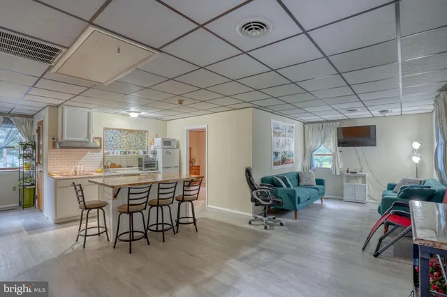 a kitchen with a table and chairs in it