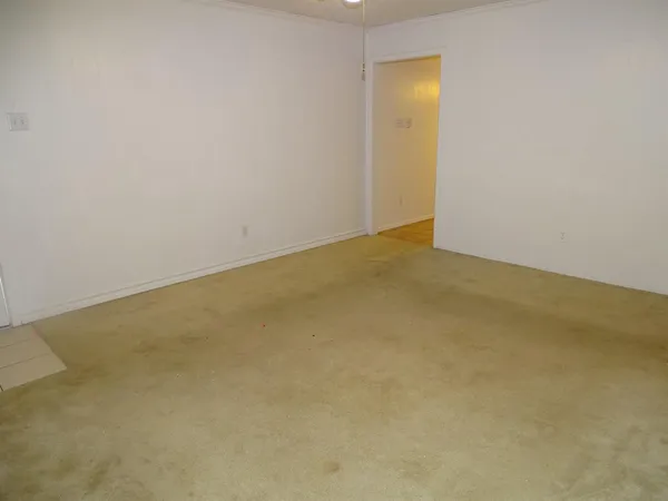 a kitchen with a refrigerator sink and cabinets