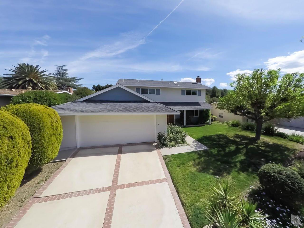 5414 Parkmor Road Calabasas, CA 91302 - Photo 1 of 58 a front view of a house with a garden