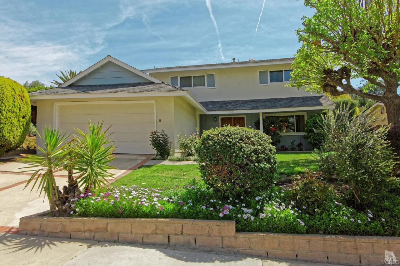 5414 Parkmor Road Calabasas, CA 91302 - Photo 12 of 58 a front view of a house with a yard and garage