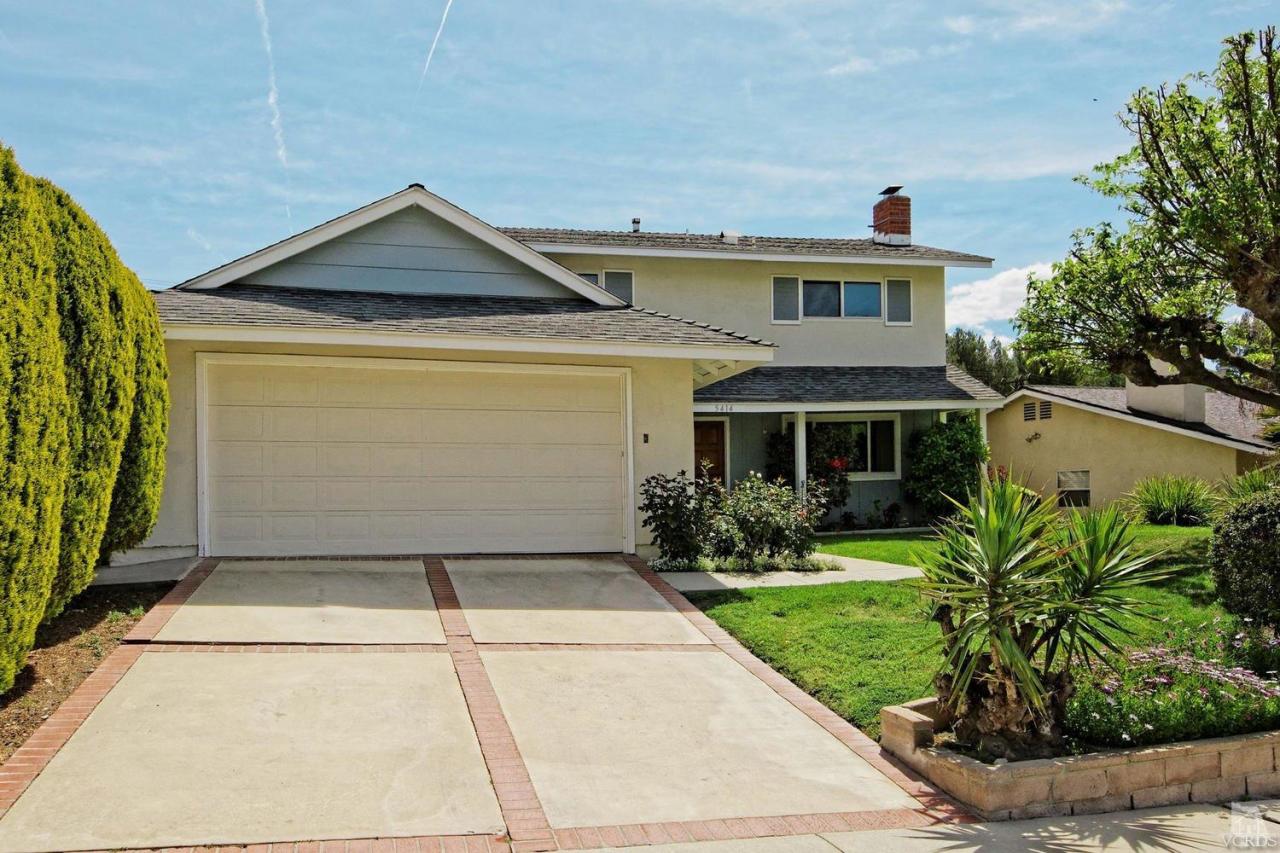5414 Parkmor Road Calabasas, CA 91302 - Photo 14 of 58 a front view of a house with a yard and garage