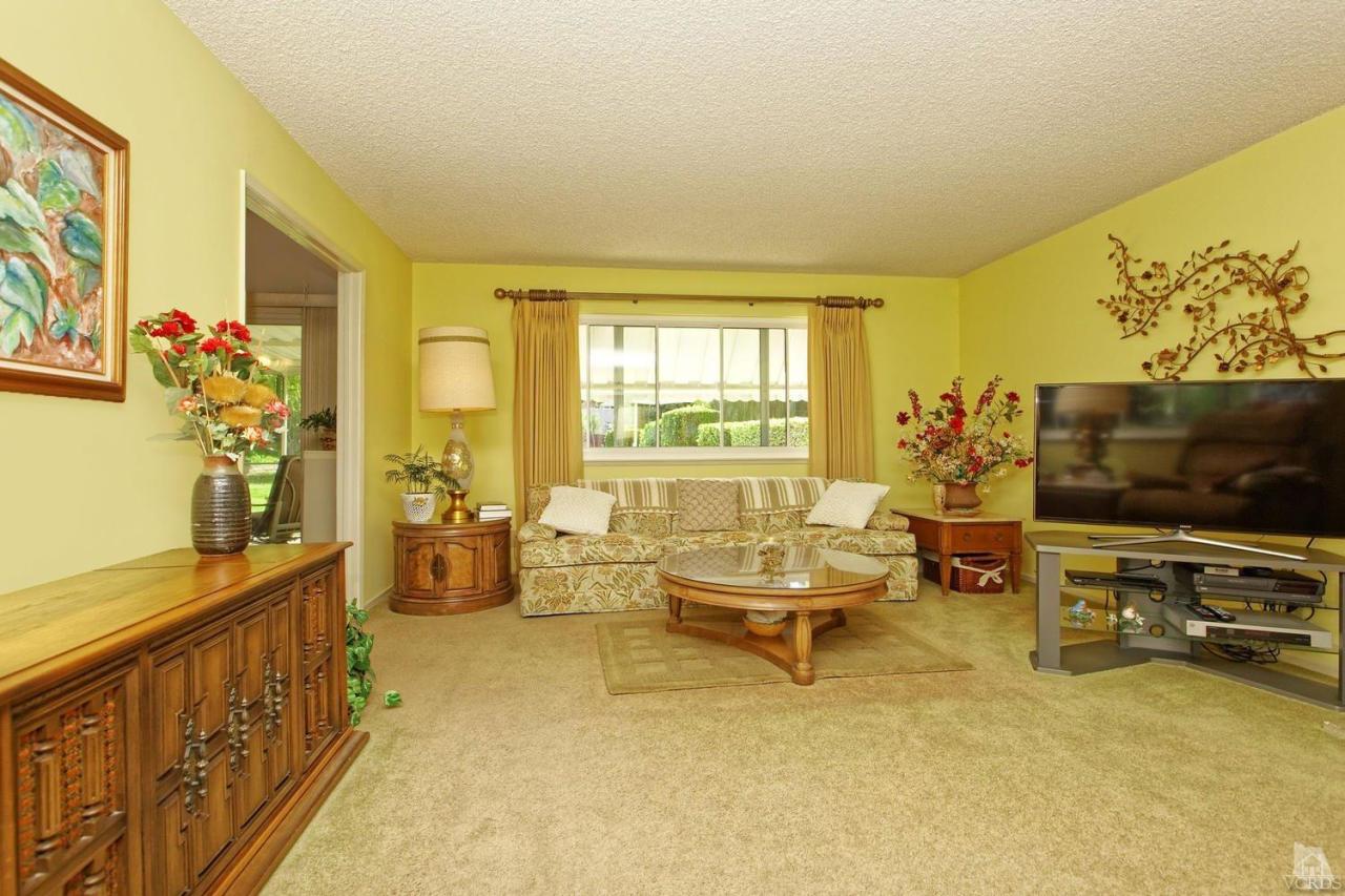 5414 Parkmor Road Calabasas, CA 91302 - Photo 19 of 58 a living room with furniture and a flat screen tv