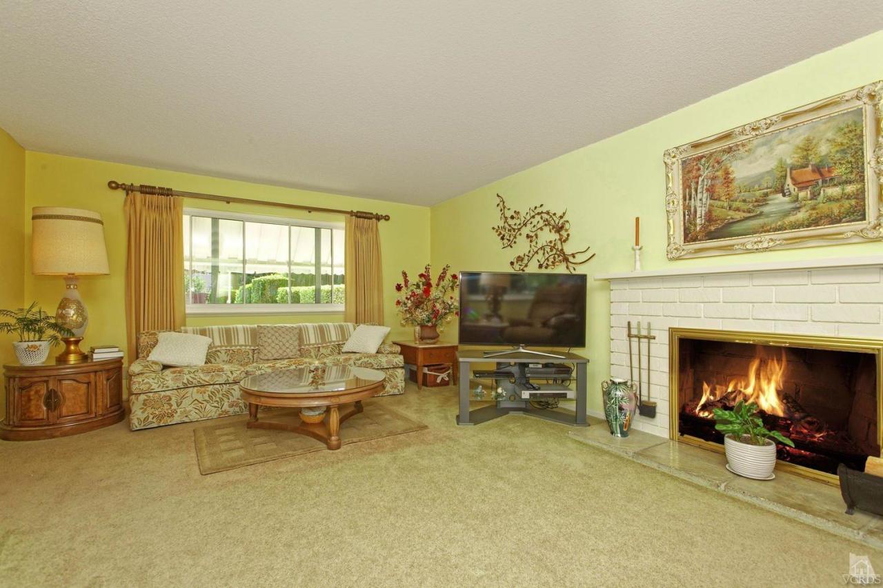 5414 Parkmor Road Calabasas, CA 91302 - Photo 20 of 58 a living room with furniture and a fireplace